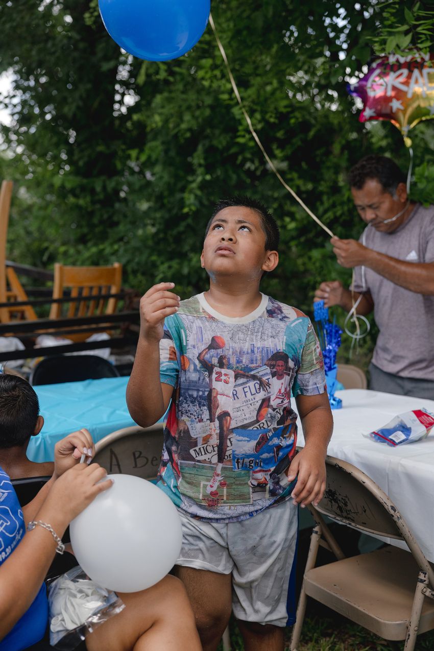The Ávila family celebrate Jeremiah’s birthday with a waterslide in José’s backyard, Friday, June 6, 2025, in Houston. (Lexi Parra for The Texas Tribune)